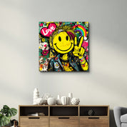 Glass wall art featuring colorful graffiti-style smile rebel pop design by Artdesigna, square-shaped decorative piece.
