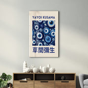 Blue eye Japanese pop art glass wall art by Yayoi Kusama, featuring vibrant blue designs on clear glass surface.