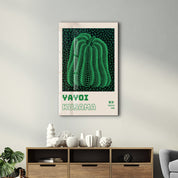Glass wall art featuring Yayoi Kusama's green pumpkin design, a vibrant Japanese pop art piece by Artdesigna.