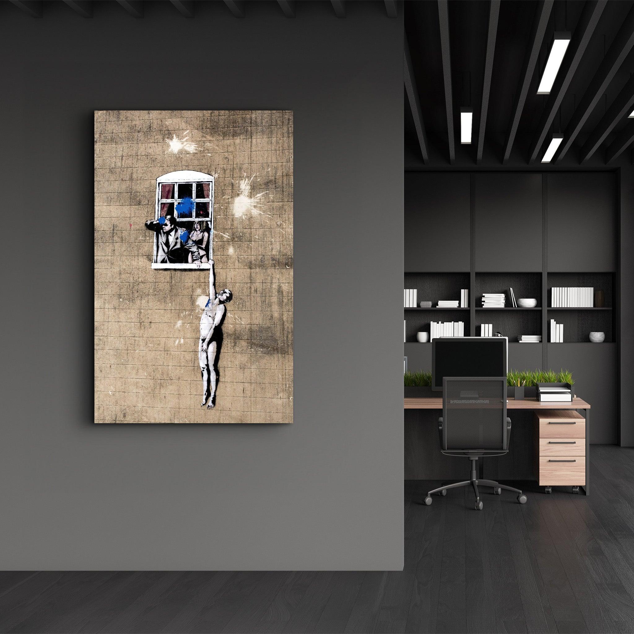 Banksy - Man hanging from a window | Glass Wall Art - Artdesigna