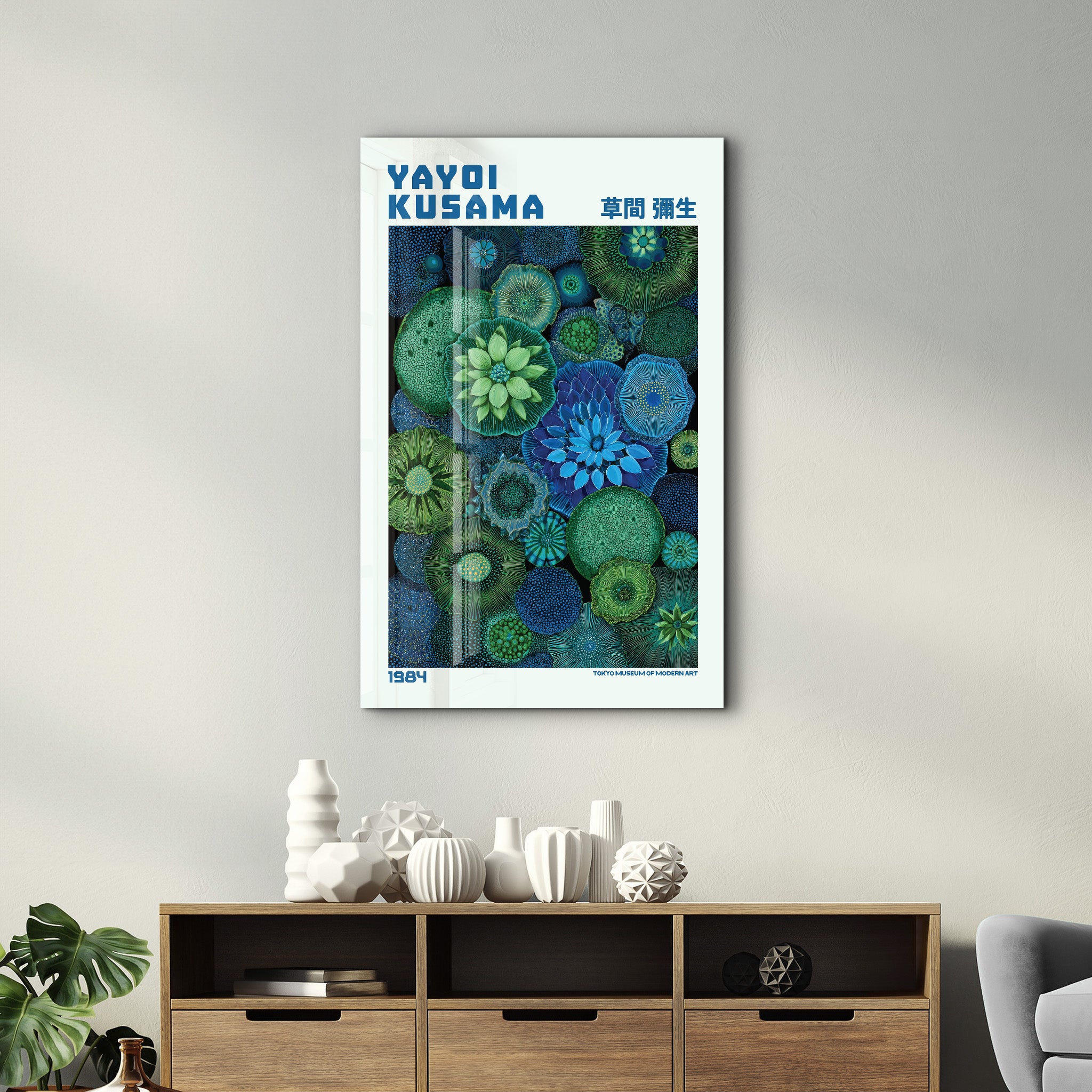 Yayoi Kusama Emerald Infinity glass wall art by Artdesigna, features vibrant green and black abstract patterns on clear glass.