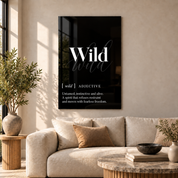 Wild Definition glass wall art by Artdesigna, black and white typography print in a living room