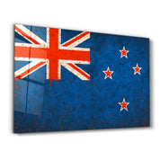 Glass wall art featuring a New Zealand flag splash design by Artdesigna, showcasing vibrant colors and modern wall decor.
