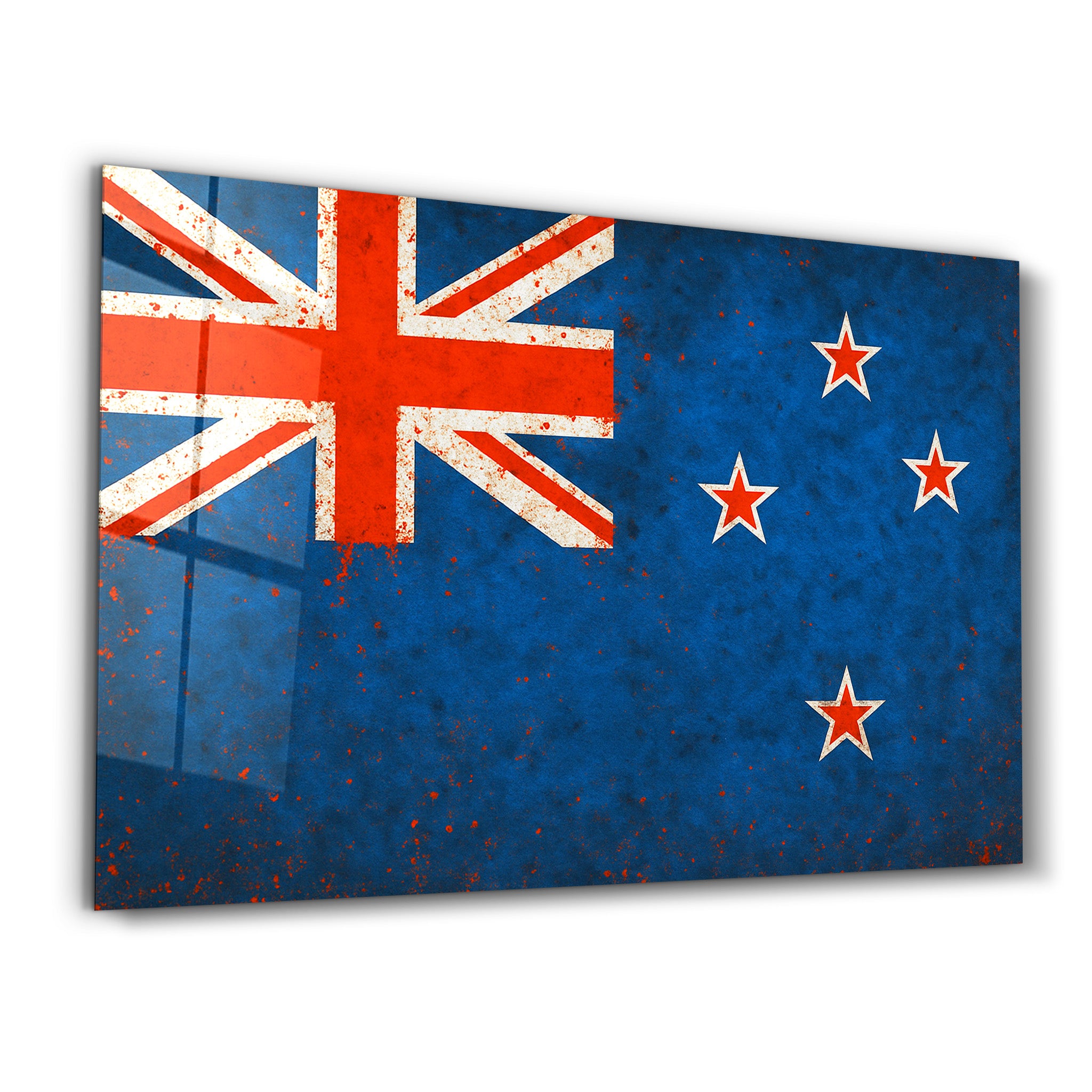 Glass wall art featuring a New Zealand flag splash design by Artdesigna, showcasing vibrant colors and modern wall decor.