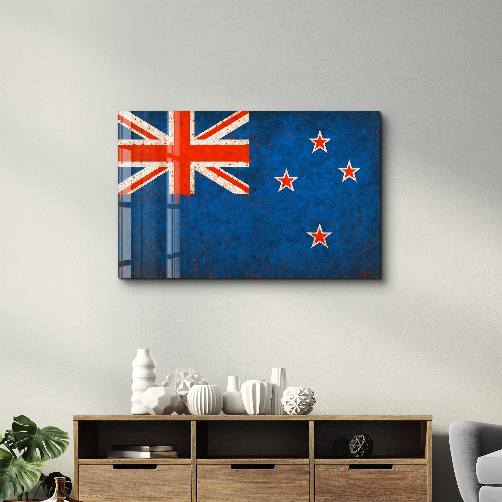 New Zealand Flag Splash glass wall art by Artdesigna, featuring vibrant flag design on clear glass for modern wall decor.