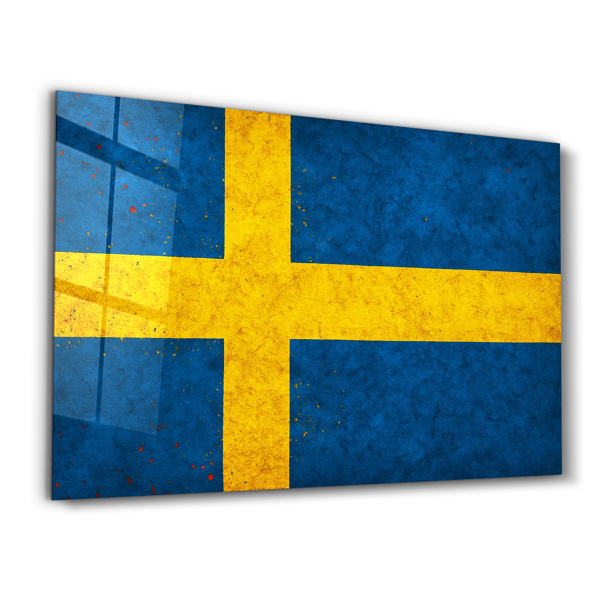 Sweden Flag Splash glass wall art by Artdesigna, featuring vibrant red and blue colors in a splash design on clear glass.