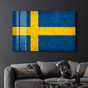 Sweden Flag Splash glass wall art by Artdesigna, featuring vibrant blue and yellow colors on clear glass wall decor.