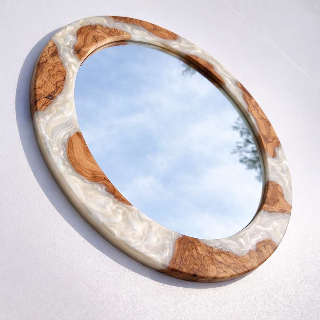 White pearl epoxy and olive wood wall art mirror featuring a circular design with natural wood grain and elegant pearl accents.