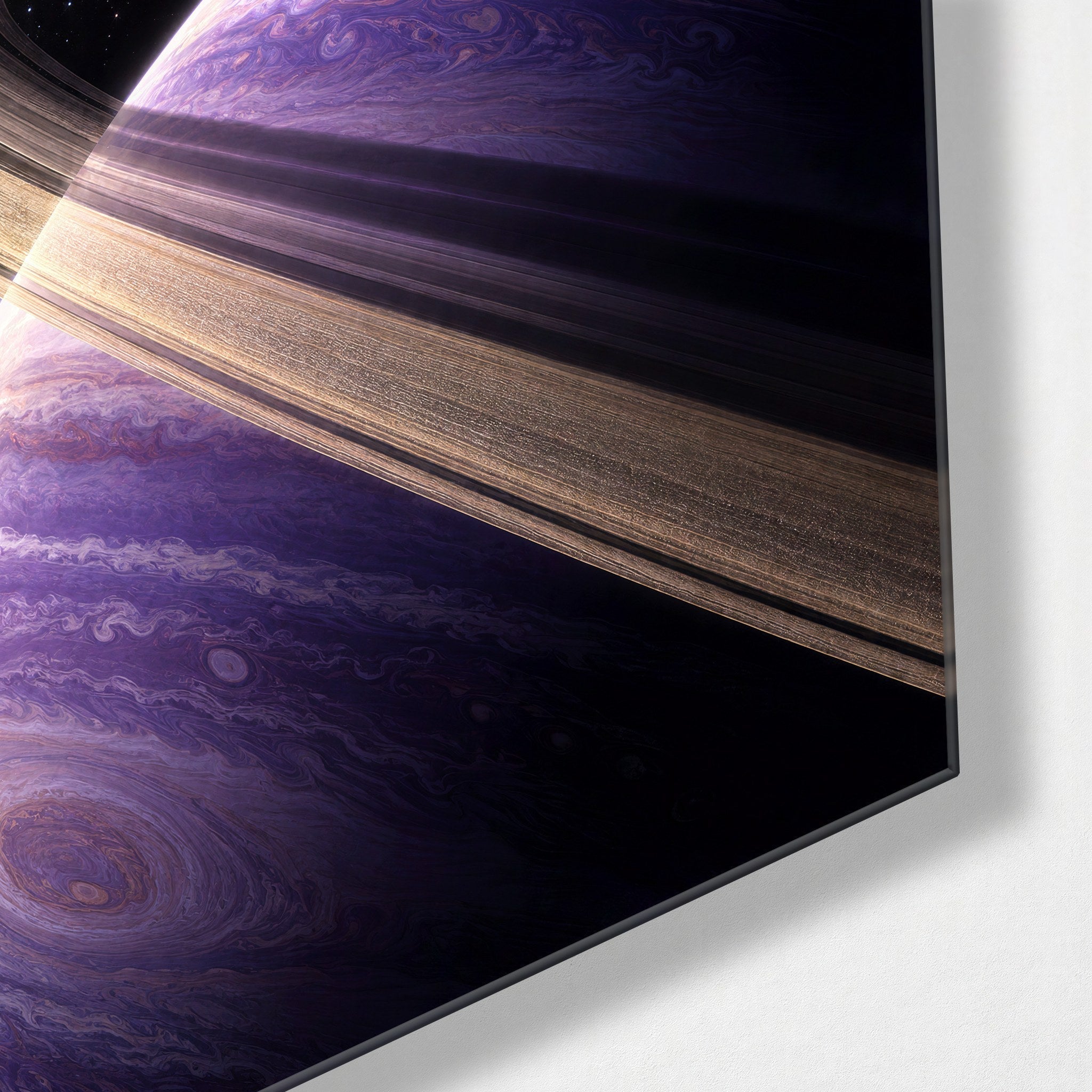 Small astronaut figure with large rings glass wall art by Artdesigna, featuring vibrant colors and a modern space-inspired design.