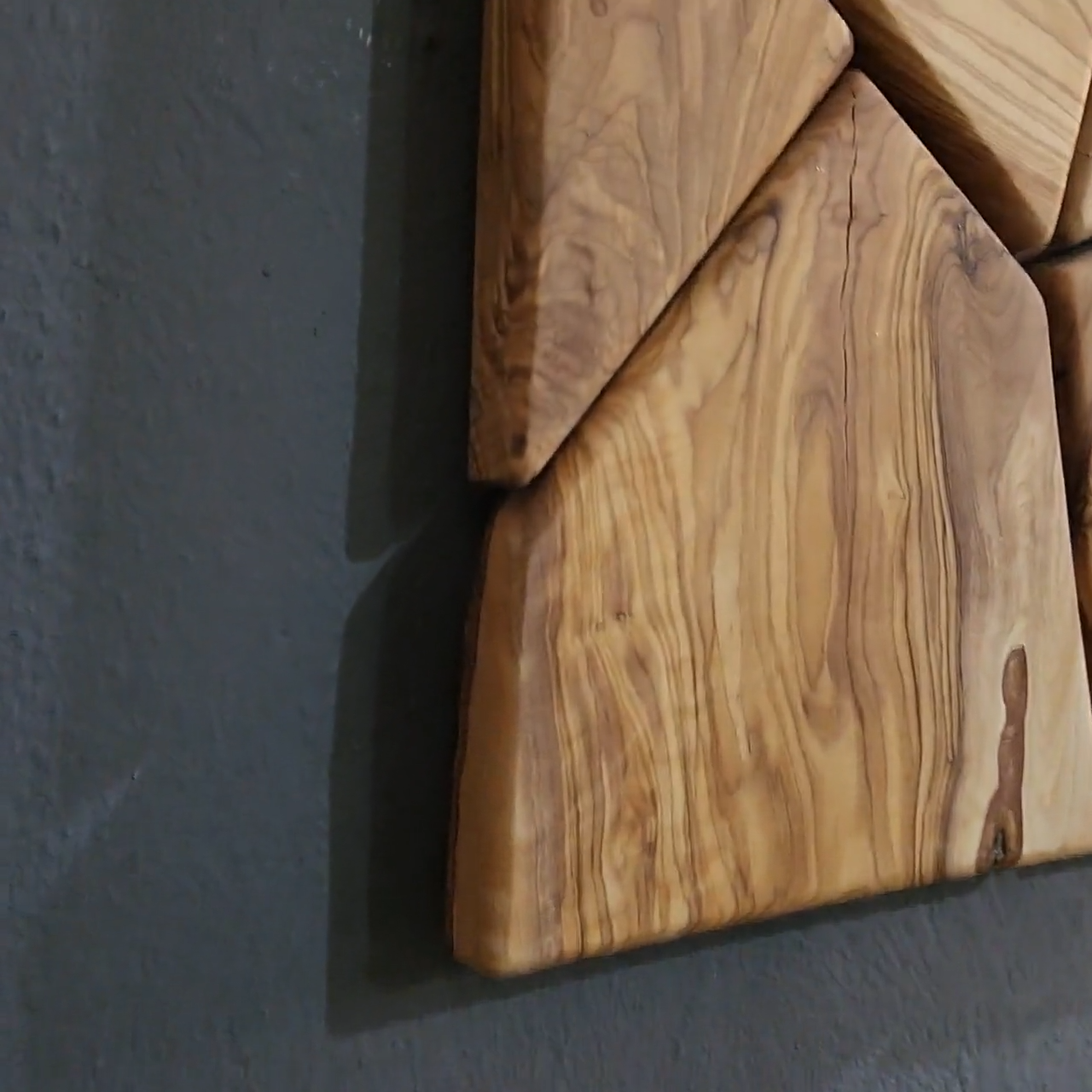 Handmade olive wood geometric wall sculpture by Artdesigna, featuring intricate wooden geometric shapes for modern wall decor.